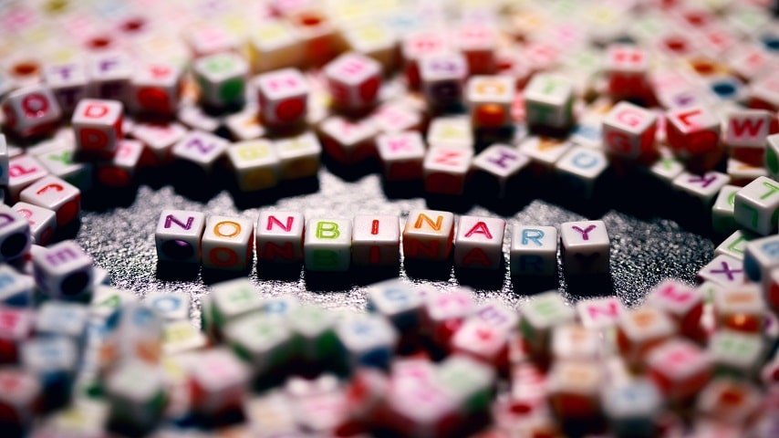 Gender Neutral Words Incorporated into Languages. Article on gender neutral translation techniques, with an image showing the term 'non-binary' made out of letter blocks.