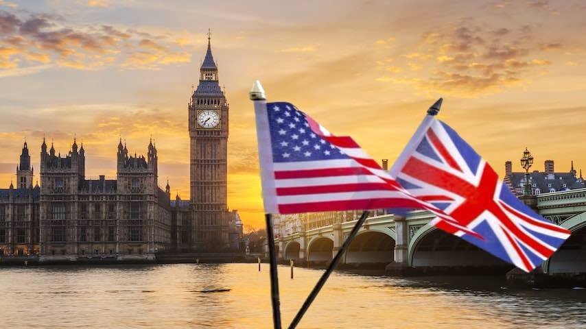 Neutral English Accent. Photo of a British and an American Flag in front of The Big Ben in London. Freepik licence: https://www.freepik.com/free-photo/big-ben-westminster-bridge-sunset-london-uk_10589985.htm