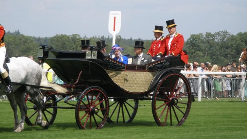 Received Pronunciation Accent Guide. Royal carriage of the British Family. Queen Elizabeth is seen waving to the public. She is sitting next to Prince Philip. Picture of Chudson at Pixabay. Pixabay License. https://pixabay.com/photos/ascot-queen-horse-england-uk-1793332/
