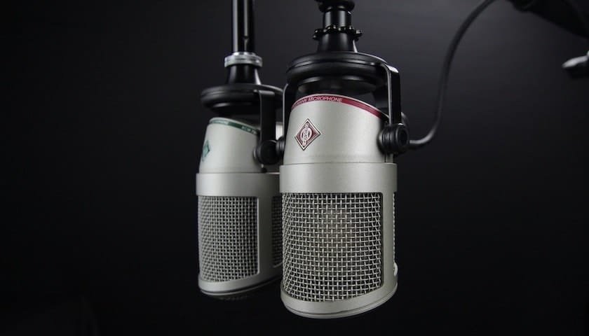 Image of a microphone on a black background to illustrate the article covering What Voice Over Microphones Are the Best?. Image from https://www.pexels.com/photo/aluminum-audio-battery-broadcast-270288/