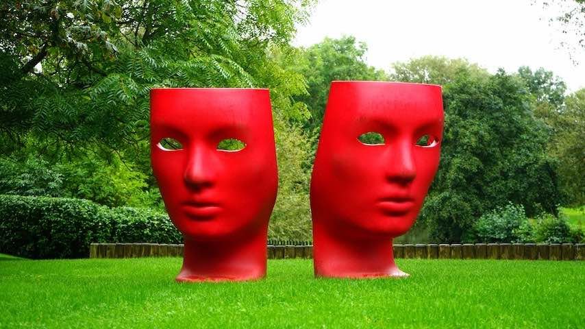 Character-Alignment. Photo of a red human face monument on green grass field by Mike B at Pexels. This photograph is used to illustrate the article The Role of Character Alignment in Voice Acting. Pexels licence: https://www.pexels.com/photo/red-human-face-monument-on-green-grass-field-189449/