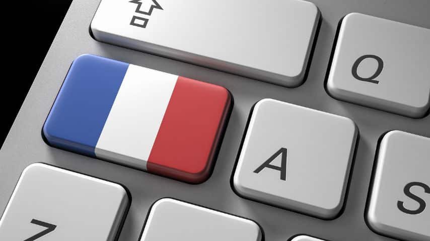 Common French False Friends to Watch Out For. Picture of a keyboard with a French Flag drawn over a key by AbsolutVision at Pixabay. Pixabay License. https://pixabay.com/illustrations/technology-flag-internet-keyboard-2648242/
