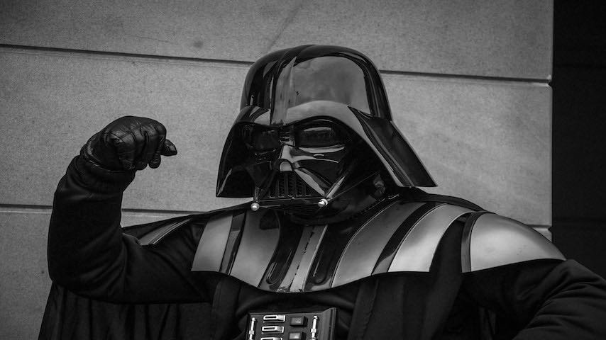 Darth Vader Voice. Image of a man dressed as Darth Vader from Star Wars. This image is used to illustrate the article “The Iconic Darth Vader Voice: Science, Art, and Future”. Photo by Tommy Van Kessel. UnSplash license: https://unsplash.com/photos/_sDlQf6f7gc