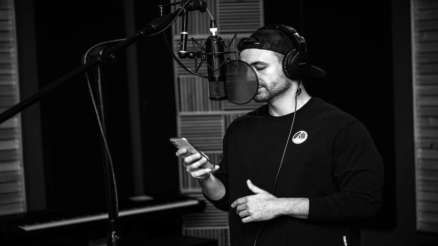 Voice Over Training. Image of young male musician using a smartphone in a studio. This image is used to illustrate the article “Beginner's Guide to Voice Over Training”. Pexels license: https://www.pexels.com/photo/young-male-musician-using-smartphone-in-studio-4158645/