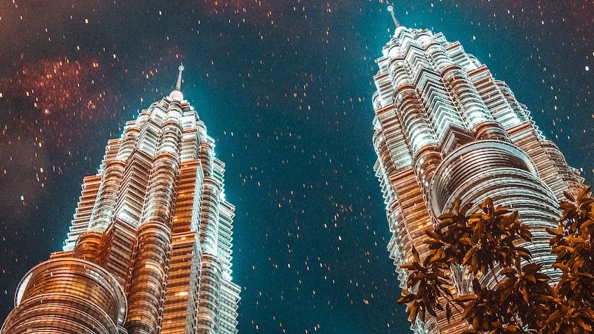 Image of the Petronas Twin Towers to illustrate an article on Malay voice over, Malay translation, Malay subtitles, and Malay captions. Photo by Moosa Haleem on Unsplash